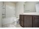 Well-lit bathroom featuring a tub-shower combo, toilet, and modern vanity at 20162 W Buchanan St, Buckeye, AZ 85326