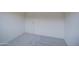 A carpeted bedroom with a door to the right and neutral walls at 20162 W Buchanan St, Buckeye, AZ 85326