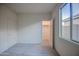 This carpeted bedroom has a closet and window at 20162 W Buchanan St, Buckeye, AZ 85326