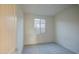 This is a carpeted bedroom with a window, light walls and trim at 20162 W Buchanan St, Buckeye, AZ 85326