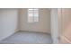 Bright bedroom with window, plush carpet, and closet at 20162 W Buchanan St, Buckeye, AZ 85326