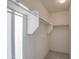 Shows a closet with white shelving and bars for organizing clothes at 20162 W Buchanan St, Buckeye, AZ 85326