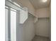 Walk-in closet with shelves and hanging rods to maximize storage space at 20162 W Buchanan St, Buckeye, AZ 85326