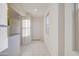 Bright entryway features neutral paint, tile flooring, and a secure front door, creating a welcoming entrance at 20162 W Buchanan St, Buckeye, AZ 85326