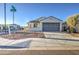 Charming single-story home featuring a two-car garage and low-maintenance desert landscaping at 20162 W Buchanan St, Buckeye, AZ 85326