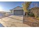 Attractive home with a two-car garage, desert landscaping, and a well-kept lawn at 20162 W Buchanan St, Buckeye, AZ 85326