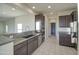 Kitchen featuring granite countertops, stainless steel appliances, and a breakfast bar at 20162 W Buchanan St, Buckeye, AZ 85326