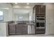 Kitchen featuring granite countertops, stainless steel appliances, and dark wood cabinetry at 20162 W Buchanan St, Buckeye, AZ 85326