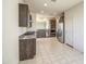 Spacious kitchen with stainless steel appliances, granite countertops, and tile flooring, perfect for Gathering meals at 20162 W Buchanan St, Buckeye, AZ 85326