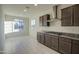 Bright, modern kitchen with stainless steel range hood and gas cooktop at 20162 W Buchanan St, Buckeye, AZ 85326