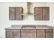 Shows a well-lit kitchen area featuring granite countertops, modern cabinetry and stainless steel gas range at 20162 W Buchanan St, Buckeye, AZ 85326