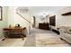 Spacious entryway featuring elegant decor, staircase, and a welcoming ambiance at 21070 N Alexis Ave, Maricopa, AZ 85138