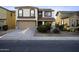 Charming two-story home with a two-car garage and a well-maintained front yard at 21070 N Alexis Ave, Maricopa, AZ 85138