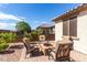 Intimate backyard patio setting with stone fire pit and seating area at 22607 W Antelope Trl, Buckeye, AZ 85326