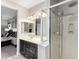 Bathroom offers double sinks and a glass shower door that shows the shower wand and head at 22607 W Antelope Trl, Buckeye, AZ 85326