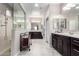 Modern bathroom featuring double sinks, and glass enclosed shower at 22607 W Antelope Trl, Buckeye, AZ 85326