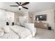 Spacious main bedroom featuring a barn door to bathroom and a comfortable seating area at 22607 W Antelope Trl, Buckeye, AZ 85326