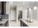 Stylish kitchen featuring granite counters, stainless steel appliances, and a convenient pantry at 22607 W Antelope Trl, Buckeye, AZ 85326