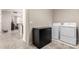 Bright laundry room features modern appliances and ample storage at 22607 W Antelope Trl, Buckeye, AZ 85326