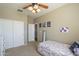 Bright bedroom featuring a cozy bed, ample closet space, and a whimsical decor for a comfortable retreat at 26842 N 176Th Ln, Surprise, AZ 85387