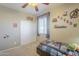 Comfortable bedroom with natural light and superhero decor provides a fun and inviting space for relaxation at 26842 N 176Th Ln, Surprise, AZ 85387