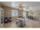 Large dining room features a modern table set and a ceiling fan at 26842 N 176Th Ln, Surprise, AZ 85387
