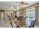 Open-concept living area with dining, kitchen and access to an outdoor patio at 26842 N 176Th Ln, Surprise, AZ 85387