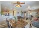 Open-concept living area with dining, kitchen and cozy sitting spaces at 26842 N 176Th Ln, Surprise, AZ 85387