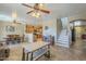 Open-concept living space with dining area, kitchen access, and a staircase at 26842 N 176Th Ln, Surprise, AZ 85387