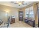 Comfortable office features a desk, shelving, and plenty of space at 26842 N 176Th Ln, Surprise, AZ 85387