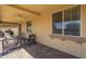 Comfortable covered patio with brick flooring, outdoor seating, and a ceiling fan at 26842 N 176Th Ln, Surprise, AZ 85387