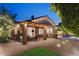 Charming patio with brick pavers, covered dining, built-in BBQ, and a view of the inviting pool at 2894 E Melody Ln, Gilbert, AZ 85234