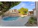 Gorgeous backyard with a sparkling pool, lush landscaping, and a covered patio area at 2894 E Melody Ln, Gilbert, AZ 85234
