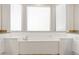 A luxurious soaking tub with granite countertops and white cabinetry offers a relaxing retreat at 2894 E Melody Ln, Gilbert, AZ 85234