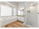 Bright bathroom featuring a large tub, separate shower, and ample natural light from multiple windows at 2894 E Melody Ln, Gilbert, AZ 85234