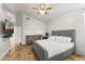 Well-lit bedroom with vaulted ceilings, comfortable bed, neutral decor, and wood floors at 2894 E Melody Ln, Gilbert, AZ 85234