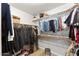 Walk-in closet with organized storage and ample hanging space with wood floor at 2894 E Melody Ln, Gilbert, AZ 85234