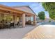 Enjoy this covered patio, featuring a built in grill and bar, as well as ceiling fans at 2894 E Melody Ln, Gilbert, AZ 85234
