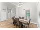 Bright dining room featuring wood table and chairs under modern chandelier at 2894 E Melody Ln, Gilbert, AZ 85234