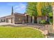 Charming single-story home showcasing desert landscaping, a three-car garage, and a welcoming front entry at 2894 E Melody Ln, Gilbert, AZ 85234