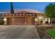 Beautiful home exterior with a spacious three-car garage, fountain, manicured lawn, and inviting curb appeal at 2894 E Melody Ln, Gilbert, AZ 85234