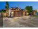 Well-lit home with three-car garage, mature landscaping, and inviting curb appeal at 2894 E Melody Ln, Gilbert, AZ 85234