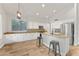 Bright kitchen featuring an island with seating, granite countertops, and stainless steel appliances at 2894 E Melody Ln, Gilbert, AZ 85234