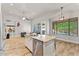 Open concept living area with kitchen and living room featuring an island at 2894 E Melody Ln, Gilbert, AZ 85234