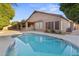 Relax in the sparkling pool and enjoy the outdoor living space with covered patio and built-in grill at 2894 E Melody Ln, Gilbert, AZ 85234