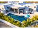 Stunning aerial view of the home, pool, outdoor kitchen and dining spaces at 37646 N Dream St, Carefree, AZ 85377