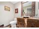 Rustic bathroom featuring a wood carved vanity with decorative mirror and vessel sink at 37646 N Dream St, Carefree, AZ 85377