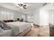 Bright bedroom boasts a ceiling fan, white plantation shutters, and a dedicated workstation area at 37646 N Dream St, Carefree, AZ 85377