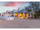 Charming single-story home with a stucco exterior, desert landscaping, and covered patio seating at 37646 N Dream St, Carefree, AZ 85377