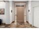 Inviting foyer with a decorative tile floor, front door with sidelights, and interior door at 37646 N Dream St, Carefree, AZ 85377
